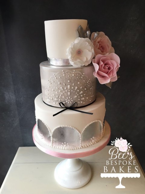 Gorgeous modern three tier wedding cake with silver leaf detail, sugar flowers, stencilling and lustre - Bee's Bespoke Bakes