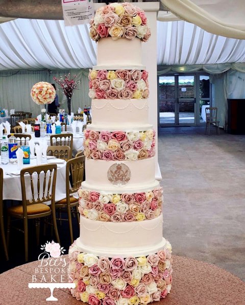 Towering ivory floral four tier wedding cake with hand piping and personalised monogram plaque. - Bee's Bespoke Bakes