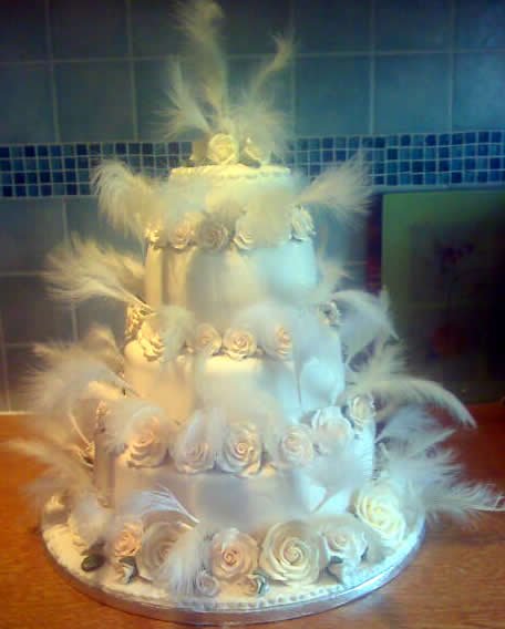 Feathered four tier - Amethyst Cakes