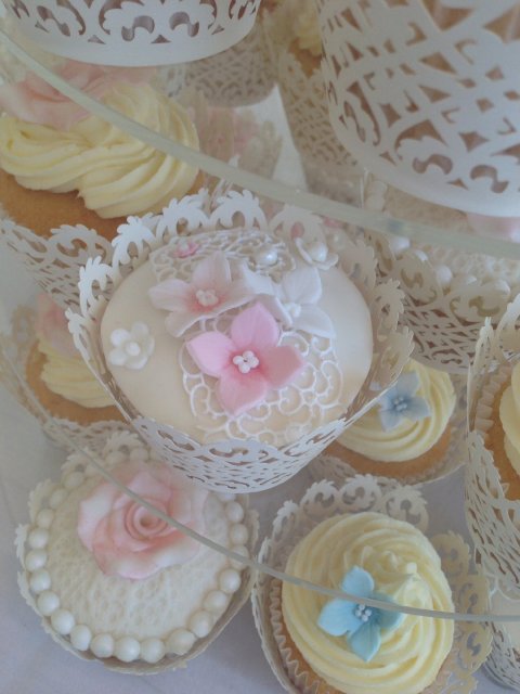 Cupcakes in lace wraps decorated with edible lace and sugar flowers - The Cake Studio Worcester
