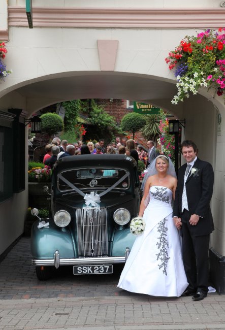 Bride and Groom at the Courtyard entrance to the Greyhound Lutterworth - The Greyhound Coaching Inn and Hotel