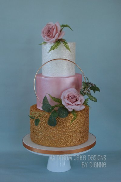3 tier Tier Wedding Cake with a modern design. Floral hoop with a textured metallic gold, pretty pink lustre and a shiny glittery tier. - Dream Cake Designs (Dianne Stanley)