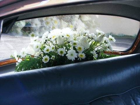Beautiful ivory wedding car flowers - Bottom Of The Garden Flowers