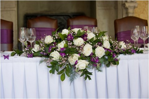 Cadburys purple top table arrangement - Bottom Of The Garden Flowers
