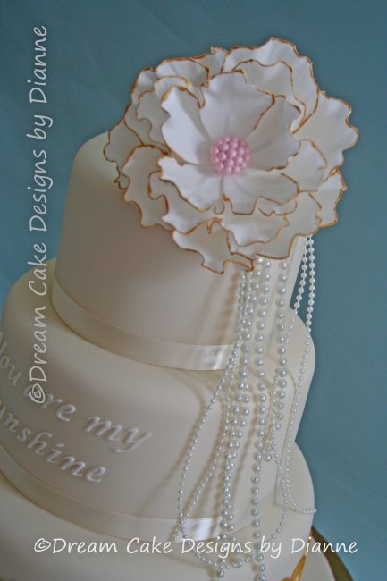 3 Tier White & Gold Wedding Cake with large fantasy flower and pearls. Inspired by 'The Great Gatsby and You are my Sunshine' - Dream Cake Designs (Dianne Stanley)