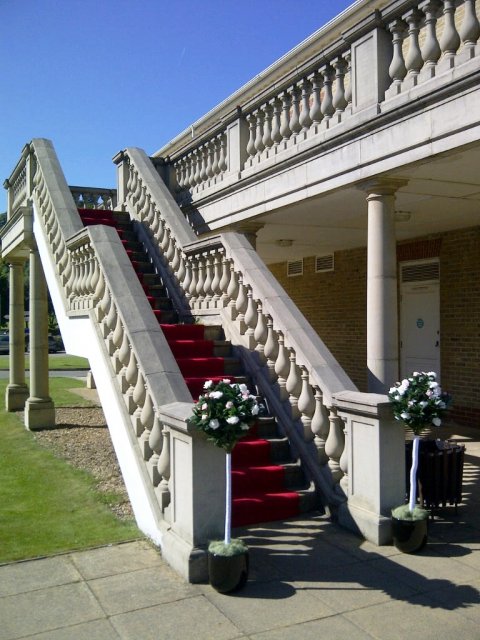 The grand stone staircase leads to the balcony - Woldingham Golf Club