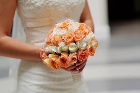A Bride Holding A Bouquet - UPHOLD ME