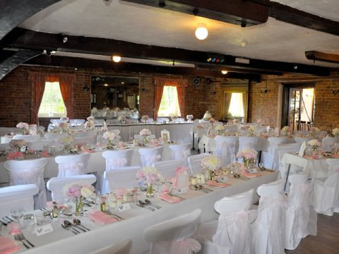 Inside The Mill Room with Long Tables - The Old Mill