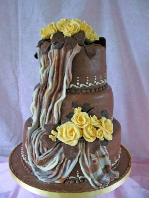 Chocolate Wedding cake with chocolate drape and yellow chocolate roses - Elizabeth Ann's Confectionery