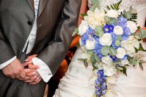 shower bouquet of ivory roses, blue hydrangea, white cymbidium orchids, and blue delphinium - Yorkshire rose florist