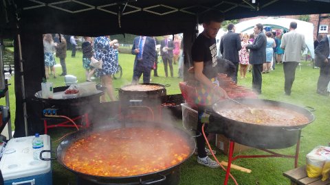 Three paellas cooking away - Buen Apetito Wedding & Party Catering