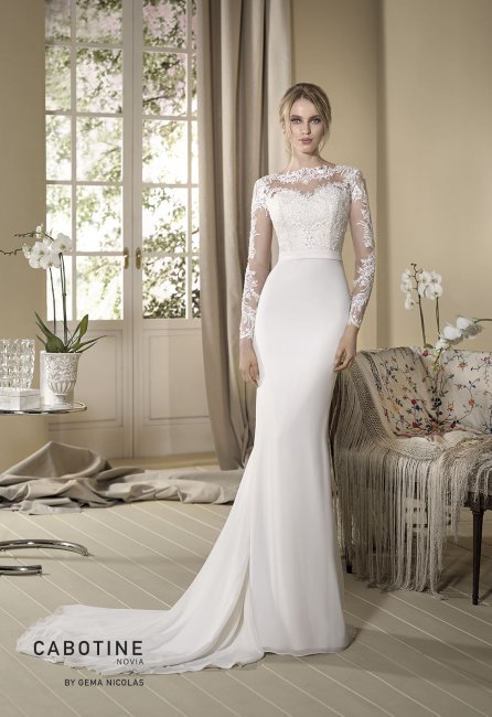 Long sleeve, mermaid wedding dress pretending to be a two-pieces outfit. Bodice crafted from nude tulle contrasting with white lace motifs and chiffon skirt. - GN DESIGN GROUP