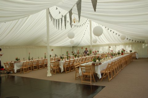 Traditiona lMarquee with tretle tables and wooden folding chairs - Carron Marquees Ltd