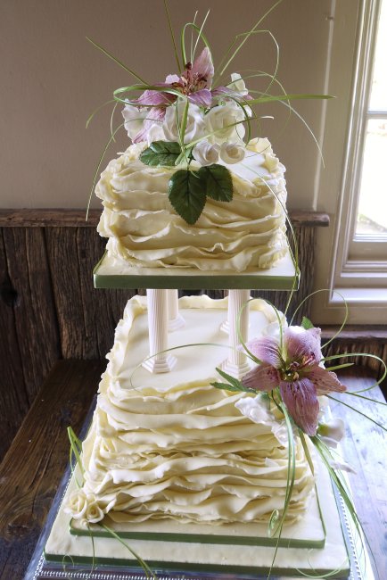 White choclate ruffle wedding cake with pink sugar flowers - Elizabeth Ann's Confectionery