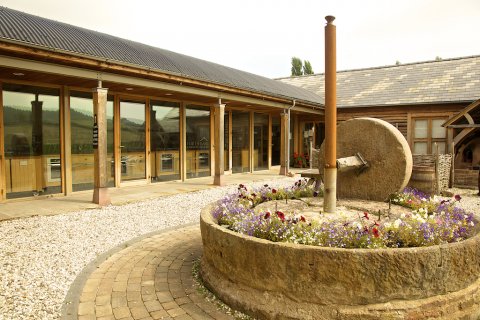 Our glass fronted school overlooks rolling hills - Harts Barn Cookery School 