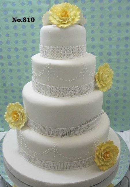 No 810 a four tier cake with Lace, Embridery and lemon Roses - Allison's Celebration Cakes
