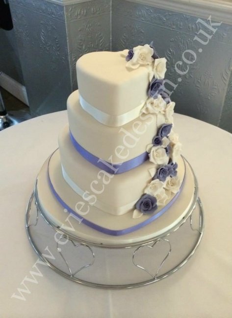3 tier heart shaped wedding cake with hand made rose cascade - Evie's Cake Design