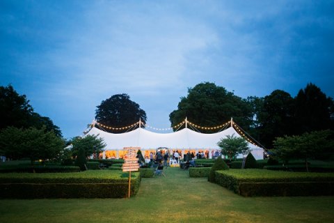 Our 9 x 30m marquee with overhead festoon lights at Scampson Hall - Will's Marquees