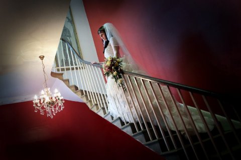 Classic staircase photo to show off this bride's stunning dress - Brooksby Hall