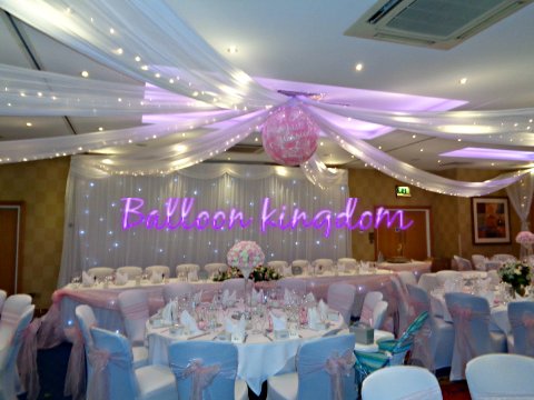 Fairligtht backdrop, ceiling swags, chair covers and giant popping balloon - Balloon and party Kingdom