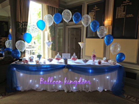 Fairylight table skirt with organza swag and ballloon arch - Balloon and party Kingdom