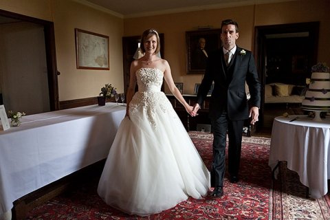 Bride & Groom coming in for the meal at Chavenage - Chavenage House