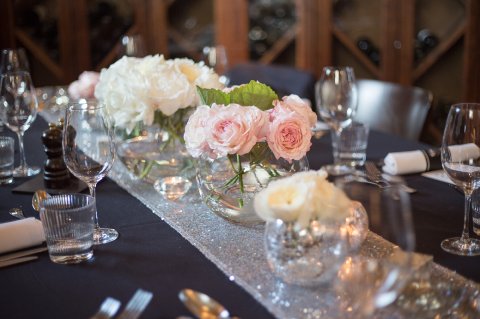 Silver sequin table runner and David Austin English Country Garden long low weeding centrepieces - Pamella Dunn Events