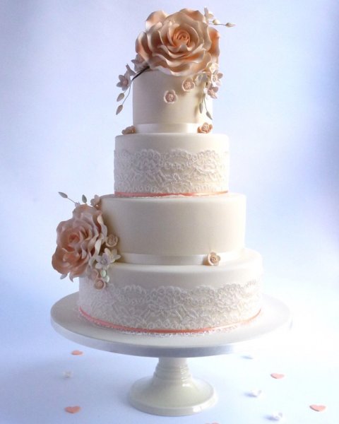 Everything I Ever Wanted. Everything I ever wanted, 4 tiers of pure vintage romance, delicate white lace, beautiful large sugar roses and dainty blossoms. The cakes can be coated white or cream and we can add a little touch of colour to the centres of the flowers. - Karen's Cakes 