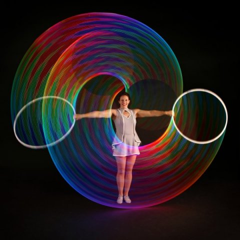 Kat Collett with cutting edge LED hula hoops - Kat Collett: Scintillating Circus Entertainment