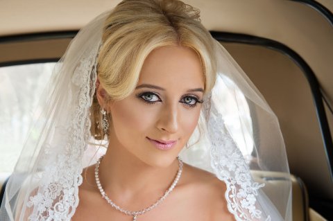 Bride in wedding car - GE Photography