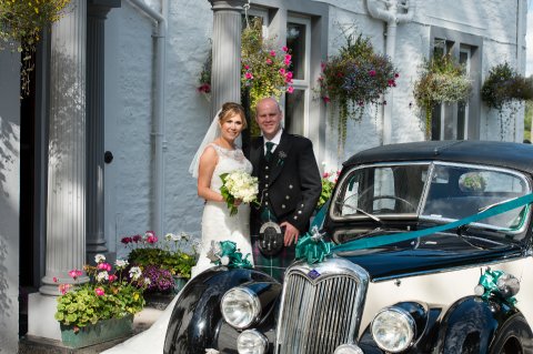 Bride and Groom with wedding car - GE Photography
