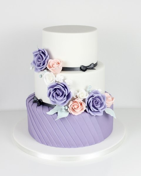 Grey & purple pleats with cascading sugar-flowers - Fay's cakes