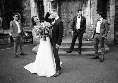 Bride and groom laughing with groomsmen at Berkeley Castle - Ketch 22 photography