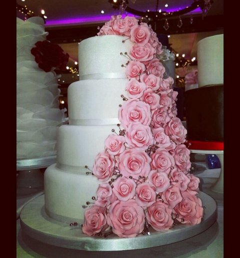 Four tier with pink flowing roses - Cakes of Good Taste