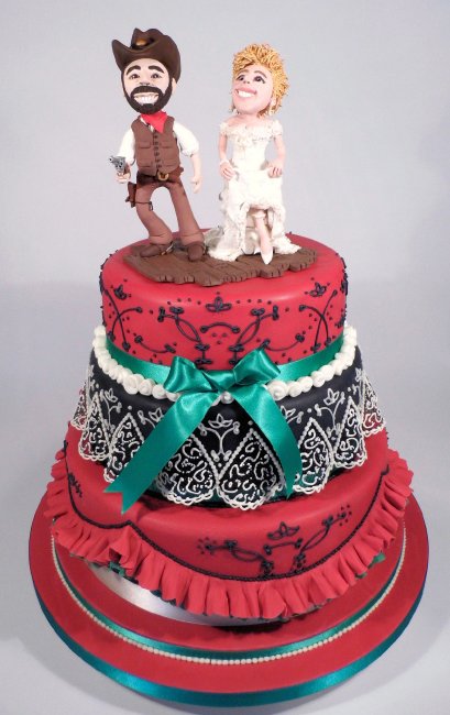 "Western Burlesque" wedding cake for a wedding with a wild west theme. With themed polymer clay cake toppers. - The Incredible Cake Company