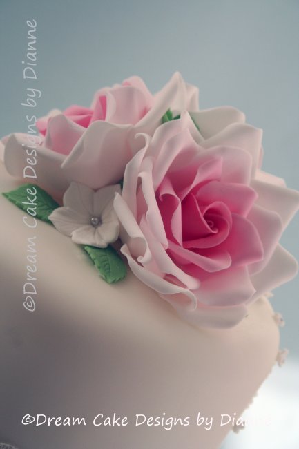 3 Tier White Wedding Cake wth pink sugar roses and delicate white blossoms - Dream Cake Designs (Dianne Stanley)