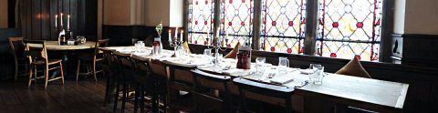 One of our long tables ideal as a "head table" in our beatiufl stained glass window - Bel & the Dragon - Godalming