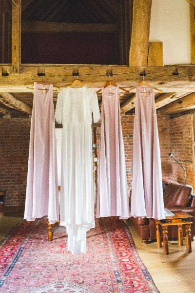 Wedding Dresses hanging in the Barn - Hendall Manor Barns