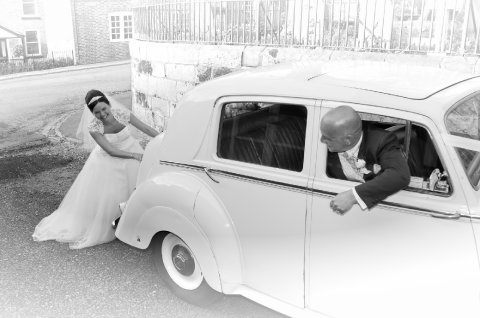 Bride pushing wedding car - Blue Ribbon Photos