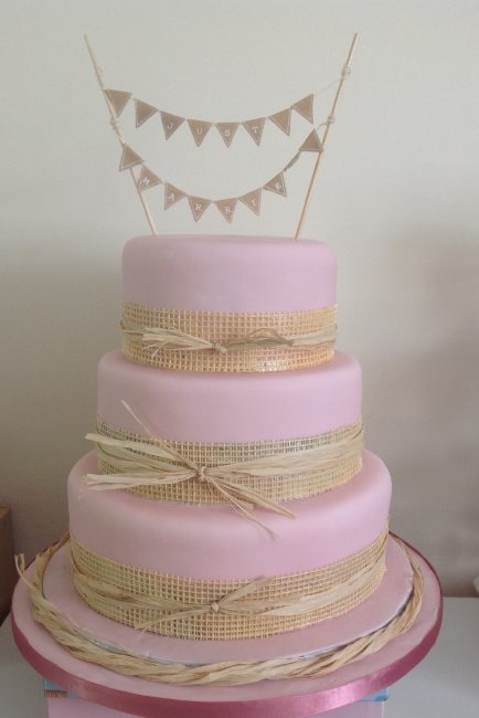 Pink three tier with edible hessian and edible bunting - Cakes Unlimited of Yorkshire