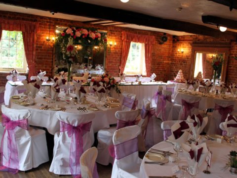 Inside The Mill Room with Round Tables - The Old Mill