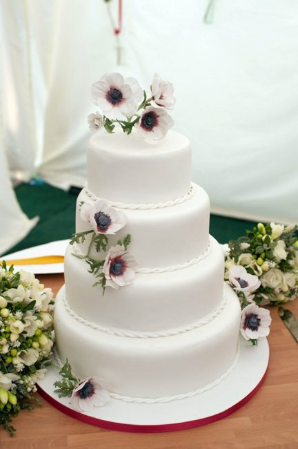 Four tiered traditional fruit cake with homemade marzipan, and sugar anemone flowers. - Rachel's Cake House