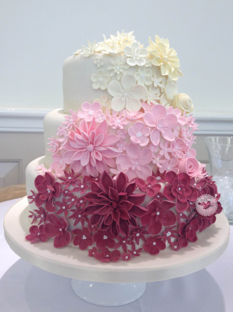 Shades of sugar flowers decorate this stylish cake. - Sophisticakes 