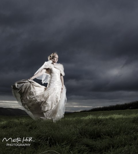 cliff top stormy bride - Martin Hill Photography 