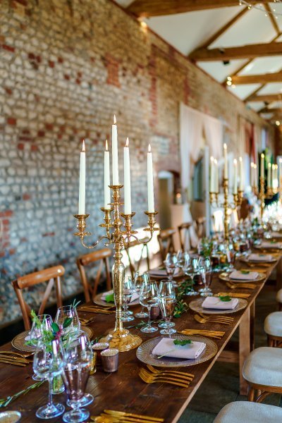 Brass table candelabra at Farbridge Barns, photo by James White Photography - Mrs