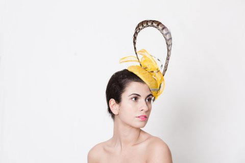 Futuristic yellow headpiece with feathers. - Katherine Elizabeth Millinery