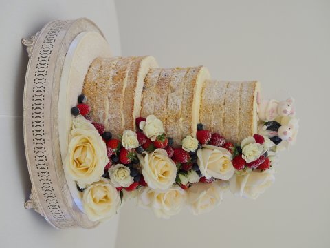 Naked style wedding cake with Fresh roses and berries - Sarah Louise Cakes