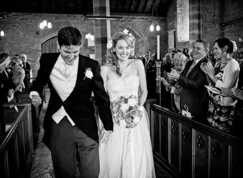 Groom punches the air with joy as he leaves wedding ceremony with his new wife! - Ketch 22 photography