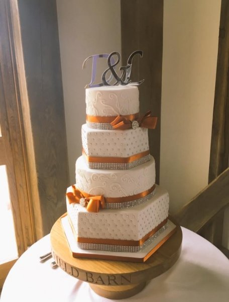 orange and white wedding cake - Calley's Cakes