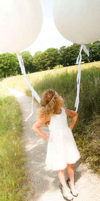 Flower girl big round balloons are stunning props for wedding photographs - Pamella Dunn Events